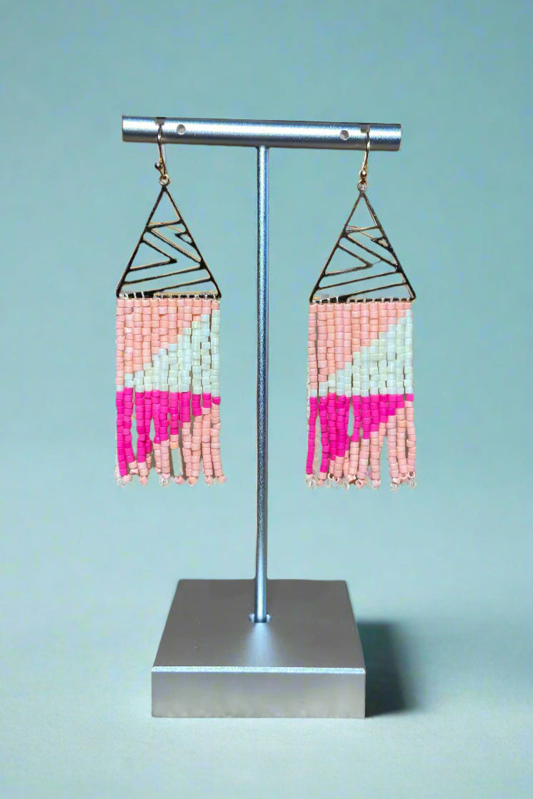 These silver triangle earrings have multi color fringe.