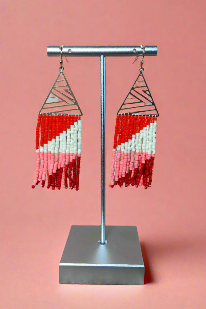 These silver triangle earrings have multi color fringe.