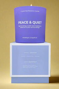 A 100% soy candle in a grapefruit scent. Crystals are embedded in the wax.