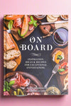 The cover of On Board: Inspiration, Ideas & Recipes For Exceptional Entertaining, a book of recipes by Derek Bissonnette and Gabrielle Cote.