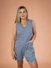 Model is wearing a stretchy ribbed knit blue and white striped v-neck romper with front pockets.