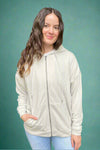 A womens basic long sleeve full zip hooded sweatshirt with front pockets in a very light Smokey taupe color.