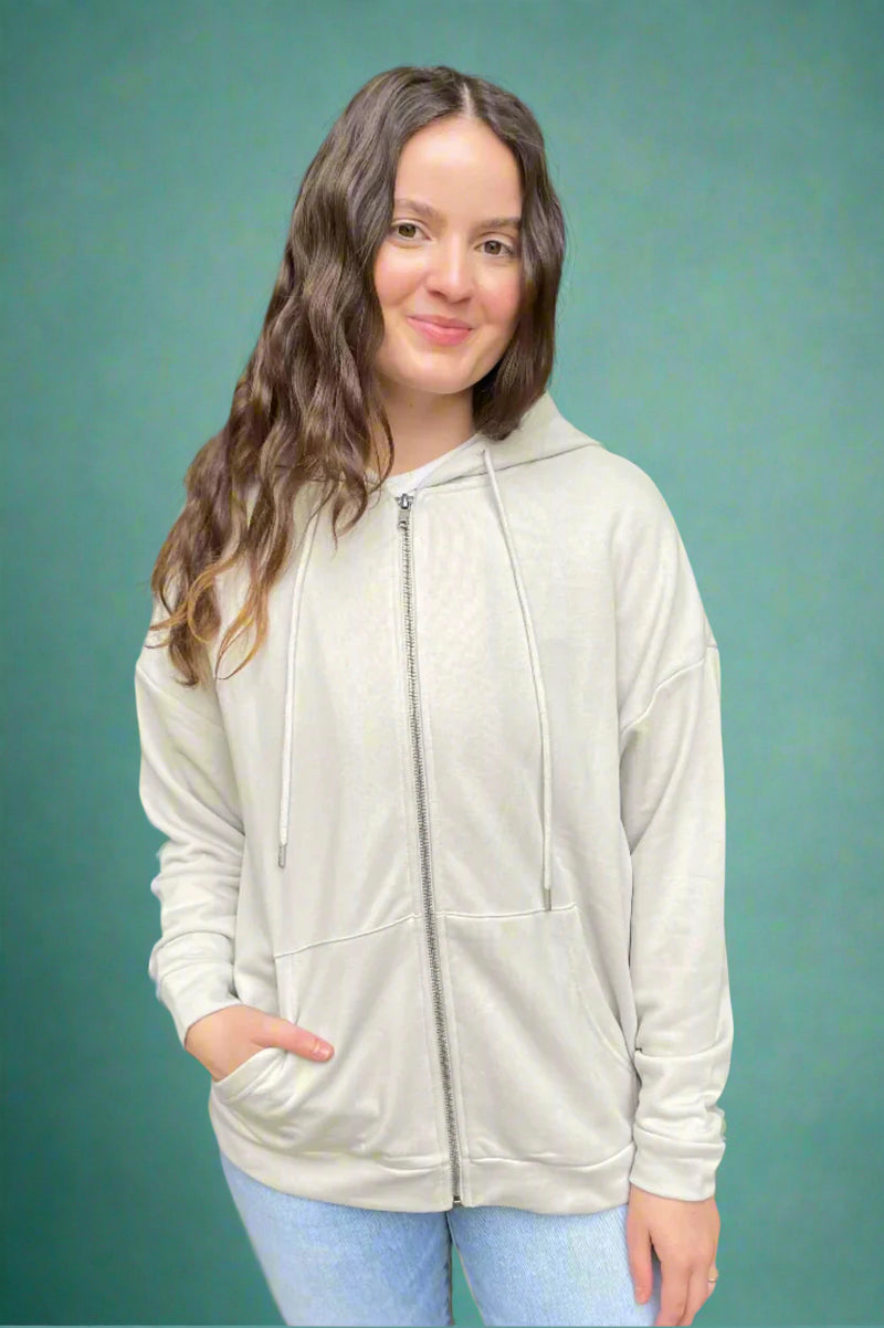 A womens basic long sleeve full zip hooded sweatshirt with front pockets in a very light Smokey taupe color.