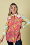 Model is wearing a breezy multi color printed cotton button up shirt with embroidery detailing.