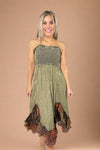 Model is wearing a smocked top olive green boho inspired midi dress with a shark bite style ruffle hem.