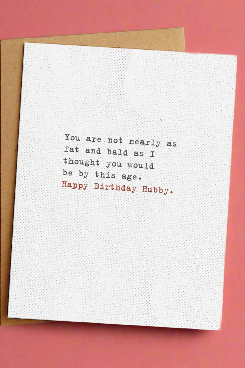 A minimalist greeting card with text that reads ‘You are not nearly as fat and bald as I thought you would be by this age. Happy Birthday Hubby.’