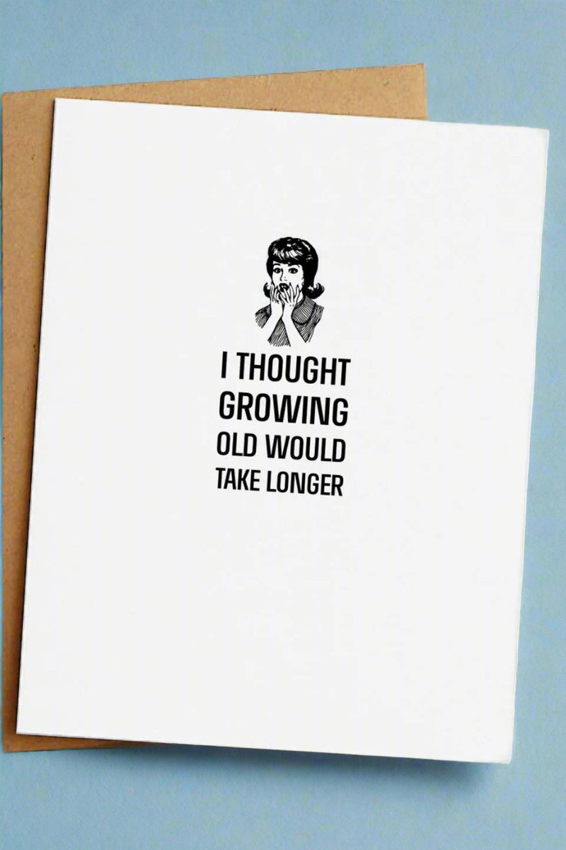 A greeting card with a small black and white image of a vintage woman gasping and black text that reads ‘I thought growing old would take longer’.
