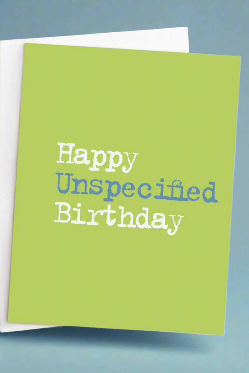 A solid green greeting card with typewriter text that reads ‘Happy Unspecified Birthday’.