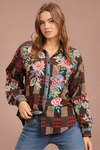 This brown, long sleeve top has colorful embroidery on the front and sleeves. It is a button up front.