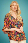 A womens flowy ruffle sleeve blouse with babydoll cut and v-neckline featuring a tropical fauna print in orange, magenta, and teal.