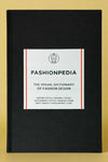 A black hardcover book titled "Fashionpedia".
