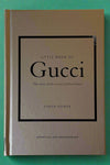 Small gold hardcover book titled "Little Book of Gucci".