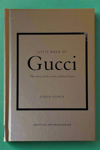 Small gold hardcover book titled "Little Book of Gucci".