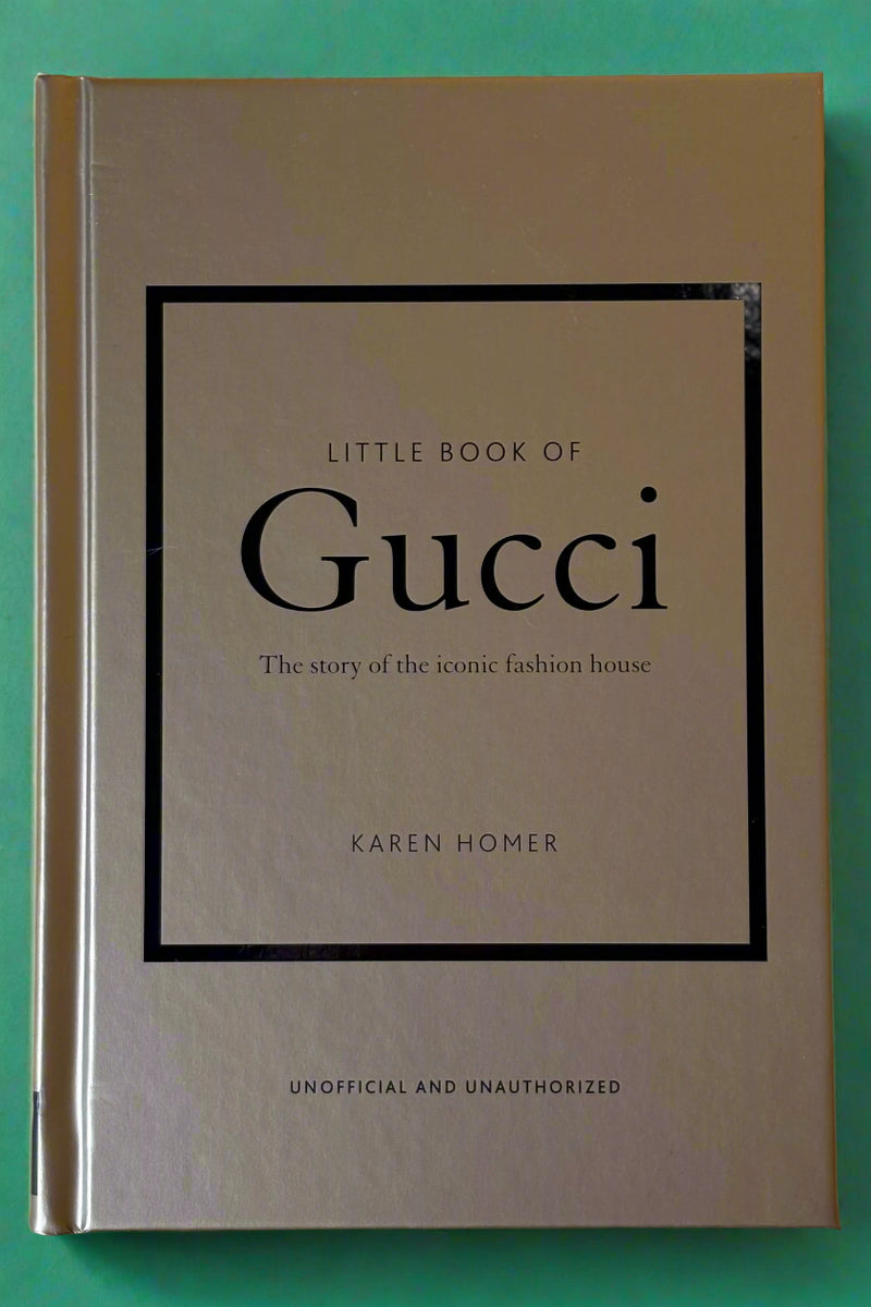 Small gold hardcover book titled "Little Book of Gucci".