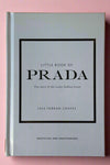 Small baby blue colored hardcover book titled "Little Book of Prada".