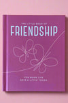 Small pink hardcover book titled "The Little Book of Friendship".