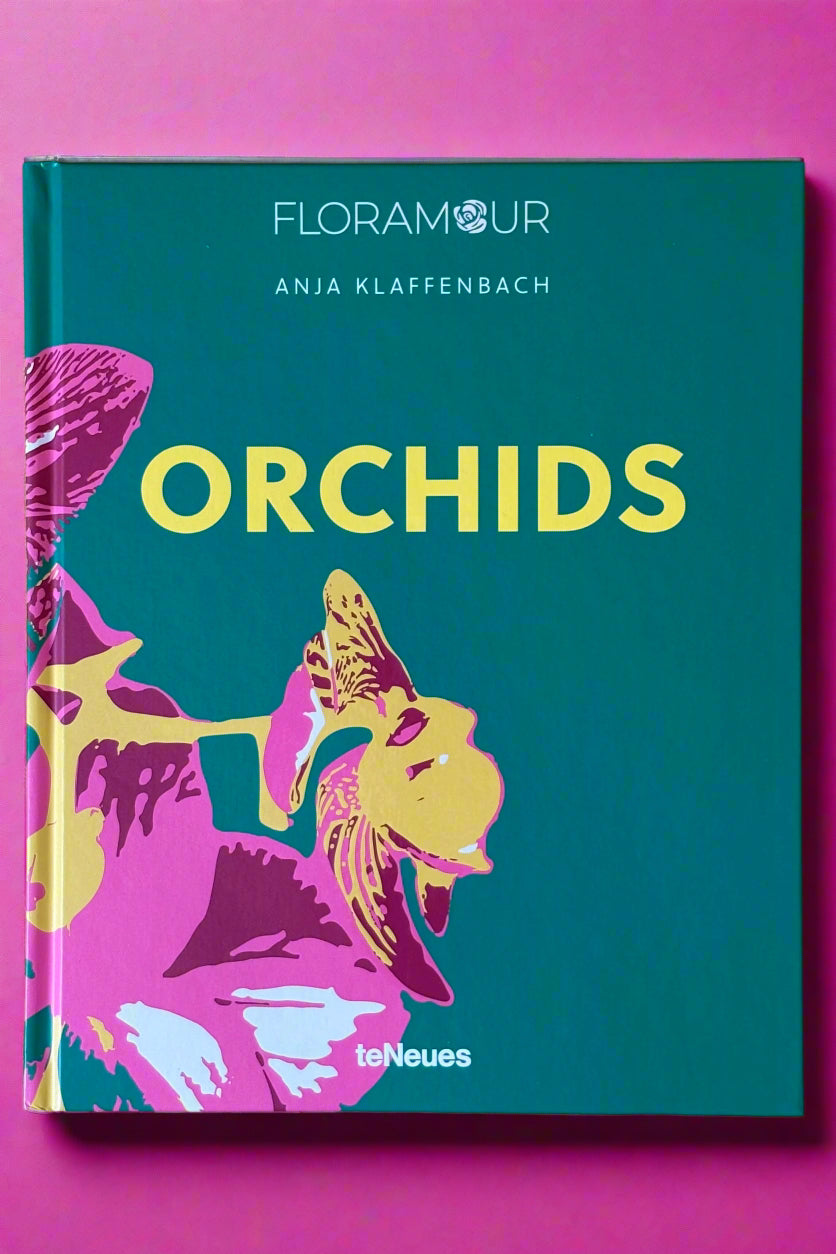 Large hardcover book titled "Orchids".