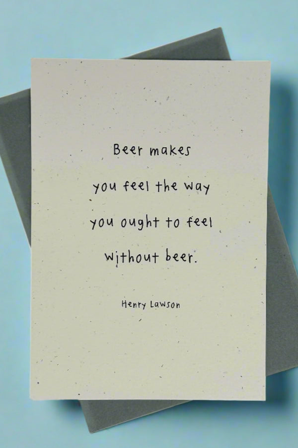 An off white card with colorful flecks that says “Beer makes you feel the way you ought to feel without beer. ~ Henry Lawson“