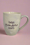 An iridescent white coffee mug with ‘best grandma ever’ written on the front.