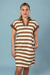Model is wearing a rugby inspired brown and white striped dress with pockets and a collar. 