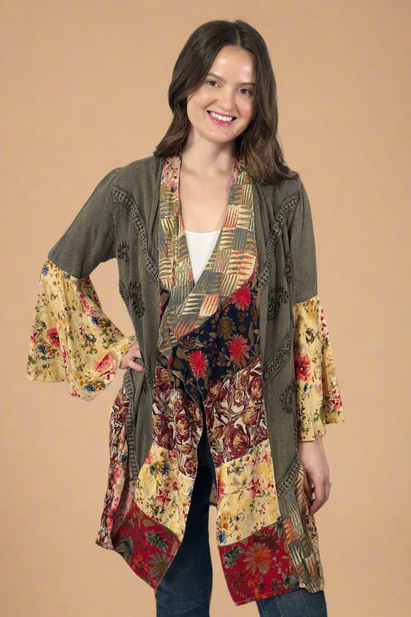 Model is wearing a boho style patchwork detail open kimono top.