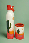 An image of a Swig mug featuring a cactus and desert print on white background. It is insulated, with a stainless steel body and a spill-resistant lid.