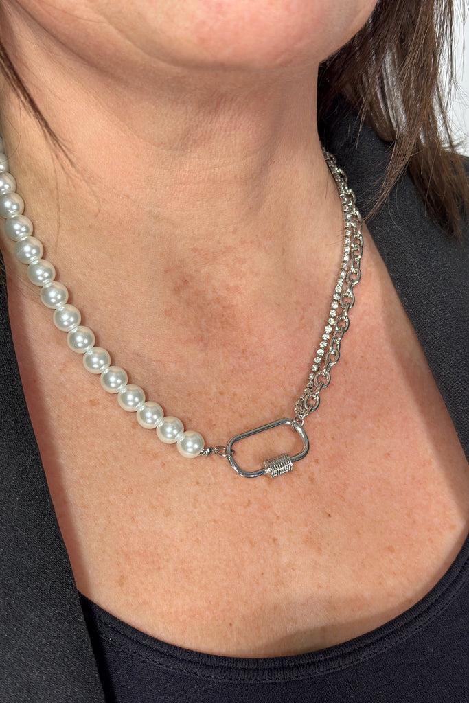 Short necklace made of alf faux pearl and half silver plated chain link layered with crystal link chain.