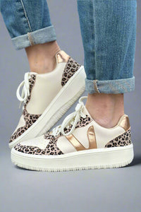 Chunky platform multi color sneakers featuring a trendy "v" design on the sides.