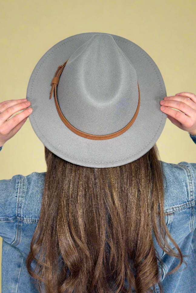 Women's vintage style fedora hat in grey felt with brown faux leather band.