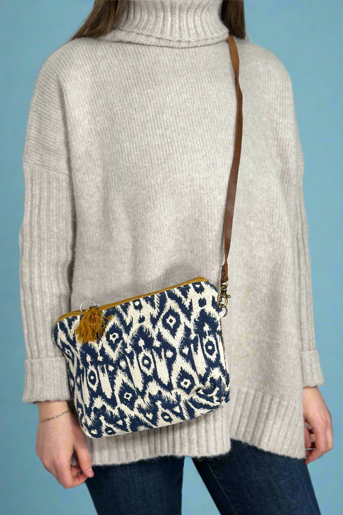 Model is wearing a diamond printed crossbody.