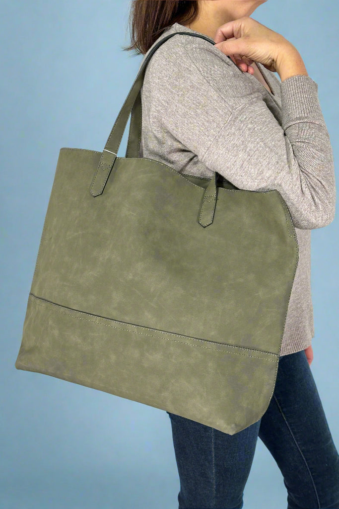 Women’s large tote bag in olive green with open top and RFID protection card slots inside.