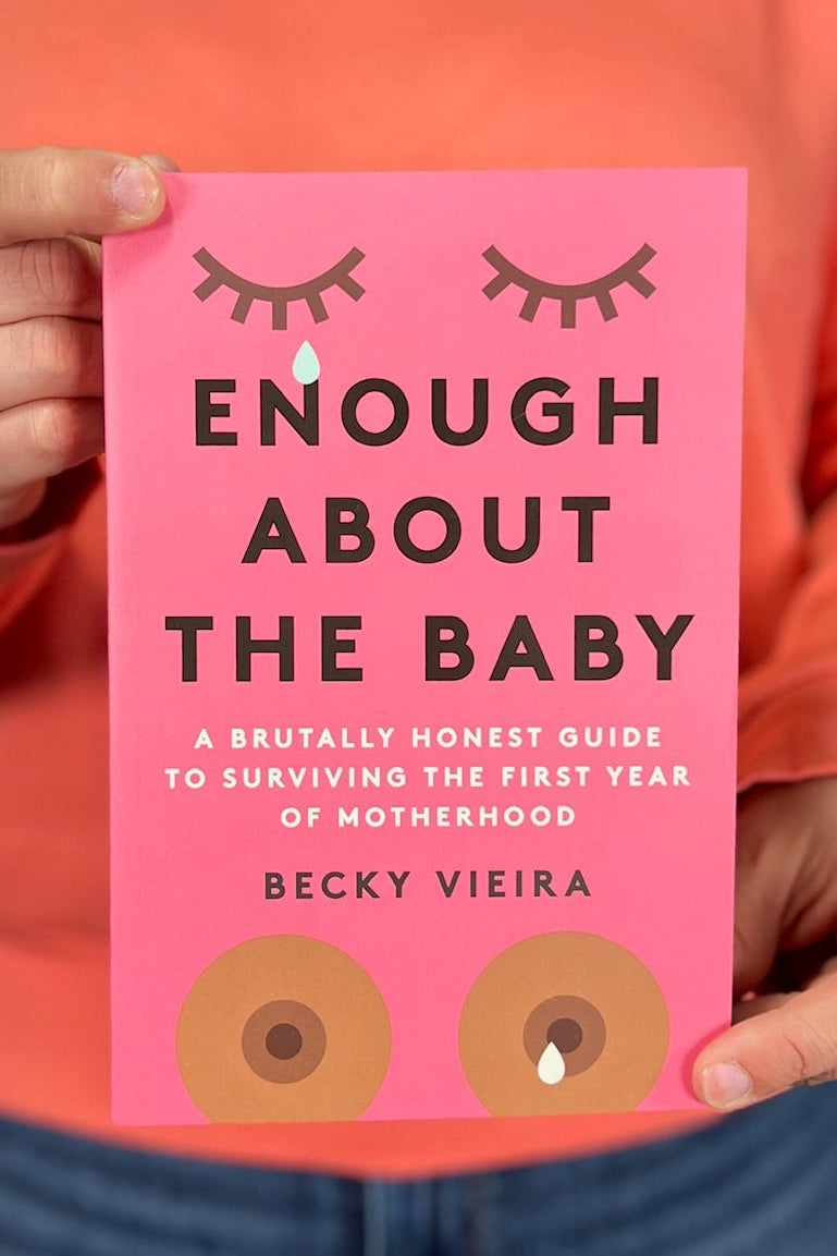 A pink book titled “Enough About The Baby”.