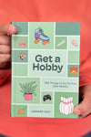 A small hardcover book titled “Get A Hobby”.