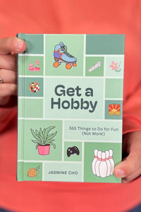 A small hardcover book titled “Get A Hobby”.