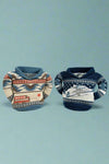 Image of two can cooler sweaters in two different patterns.