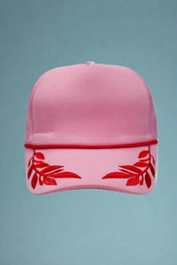 Pink foam trucker hat with fuchsia leaf pattern. Adjustable.