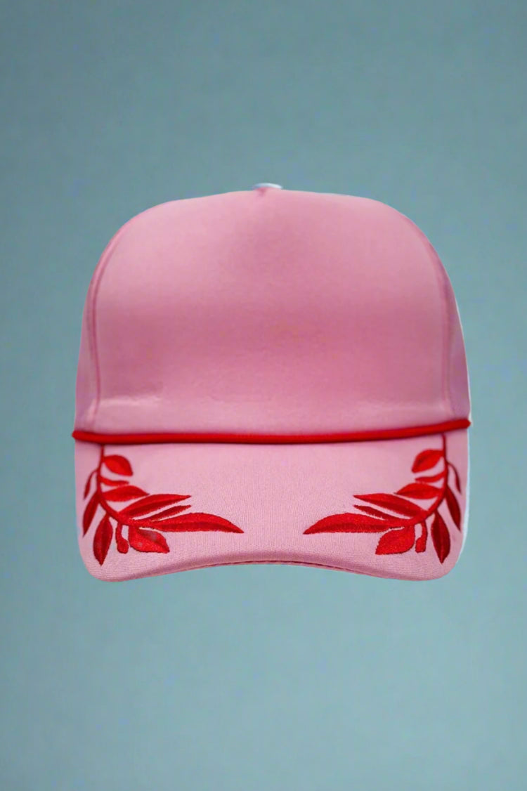 Pink foam trucker hat with fuchsia leaf pattern. Adjustable.