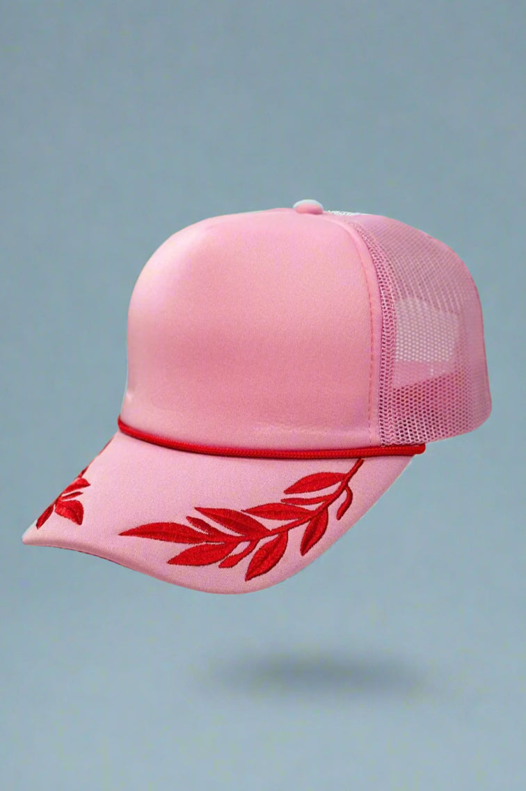 pink foam trucker hat with fuchsia leaf pattern. Adjustable.