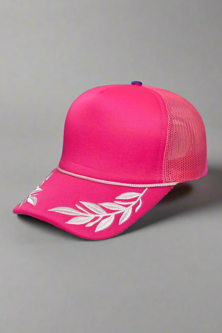 hot pink foam trucker hat with white leaf embroidery 