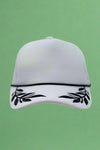 White foam trucker hat with black leaf pattern. Adjustable.