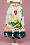 Skirt with colorful animal and abstract designs on a plain background