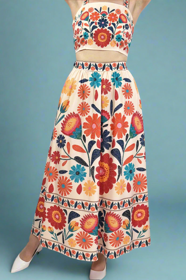 Colorful floral crop top and skirt set with a white background