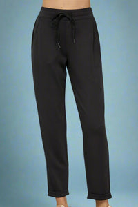 Buttery soft joggers featuring side pockets, adjustable waistband with ties, and a cuffed hem detail.