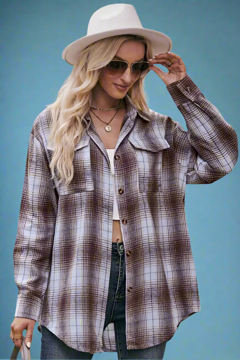 A coffee colored plaid button down shirt. It is lightweight and long in length.