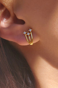 These 18k gold earrings wrap around the lobe with 3 rhinestone stars on the end, resembling shooting stars. They are hypoallergenic and nickel free.