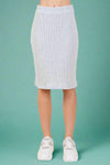 A women’s rib knit knee length pencil skirt featuring a slit in the back, elastic waistband, and soft stretchy material all made in the USA. 