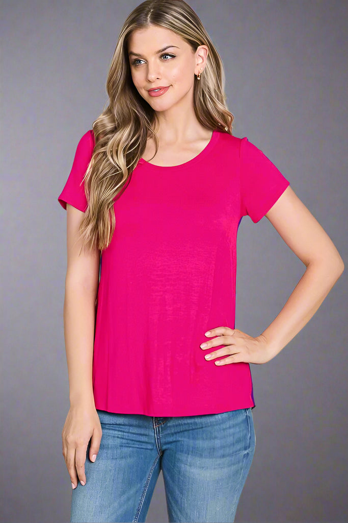 This basic, crew neck short sleeve tee is a fuchsia color. It is lightweight and medium length.