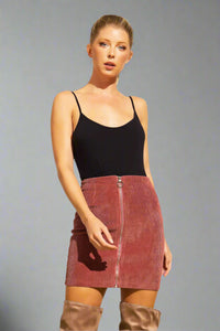 This corduroy Zip Up Mini Skirt in the color rust is made with comfy corduroy fabric and chic zip up design. 