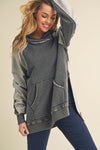 A women’s lightweight hooded sweatshirt featuring high side slits, front kangaroo pocket, and color blocked light and dark heather greys.