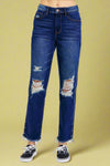 A pair of high waist straight leg jeans in a dark indigo wash by Judy Blue featuring a rigid material front, slight stretch in back, distressed knees and hem, and relaxed fit.